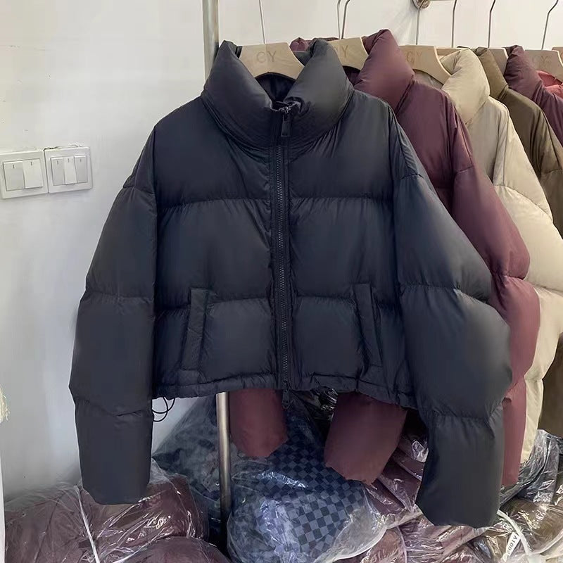 Ladies short functional quilted jacket with high collar and side pockets Lune London