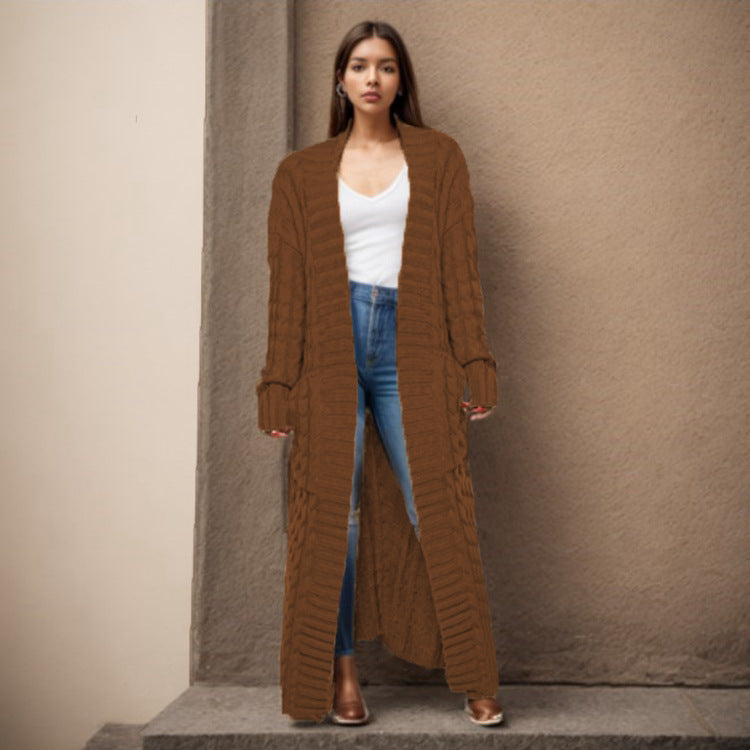 Women Thick knitted cardigan with a refined cable design and practical pockets Lune London