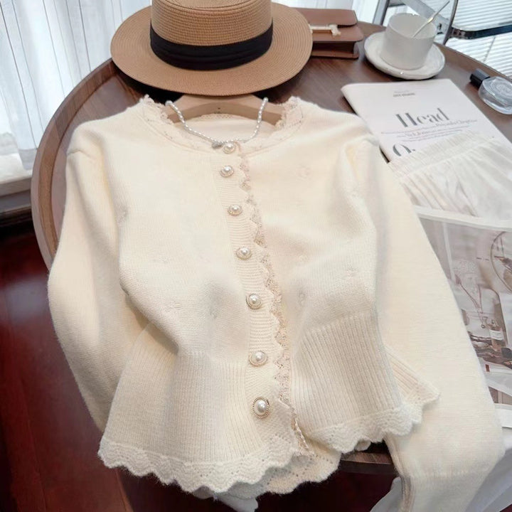 Knitted jacket for women with decorative pearl buttons and a delicate ribbed structure Lune London