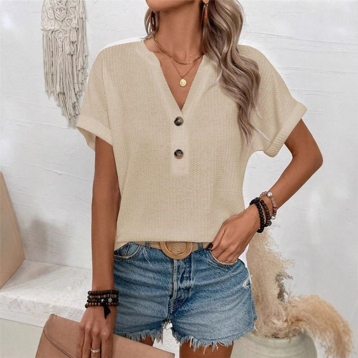 Casual short sleeve t-shirt for women with a decorative button placket design and a chic honeycomb texture