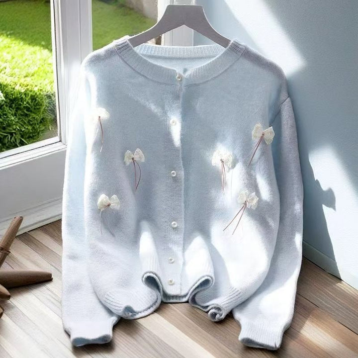Knit jacket for women with feminine appliques and chic button details