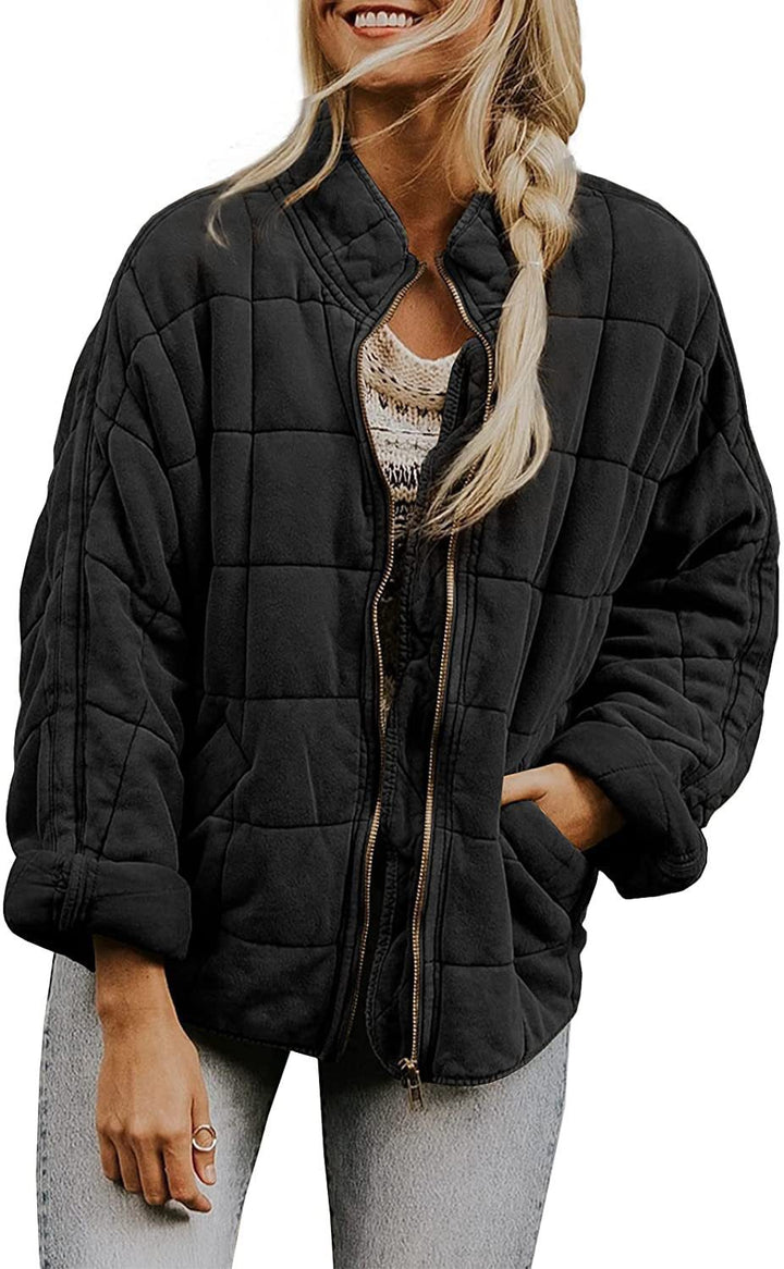 Ladies quilted jacket with high collar and practical pockets Lune London