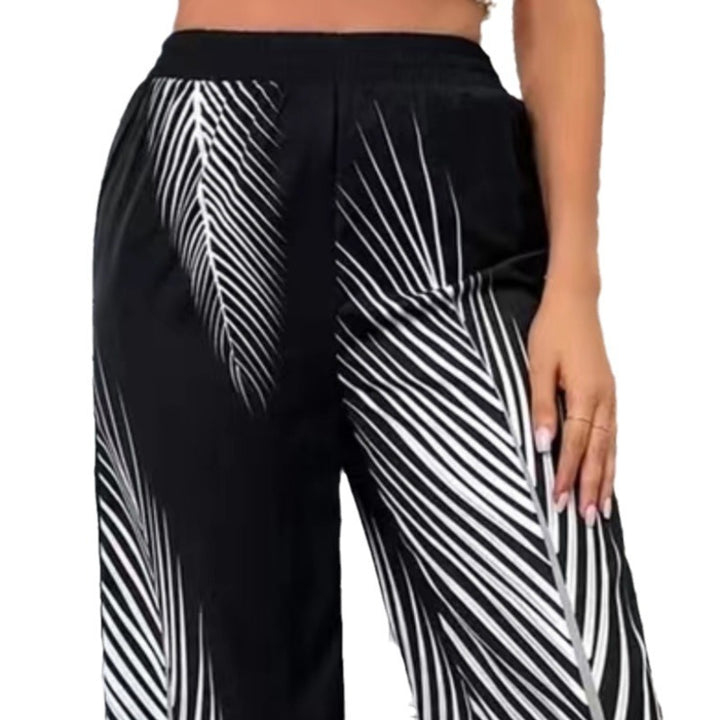 Elegant and lightweight palazzo pants for women with palm tree pattern Lune London