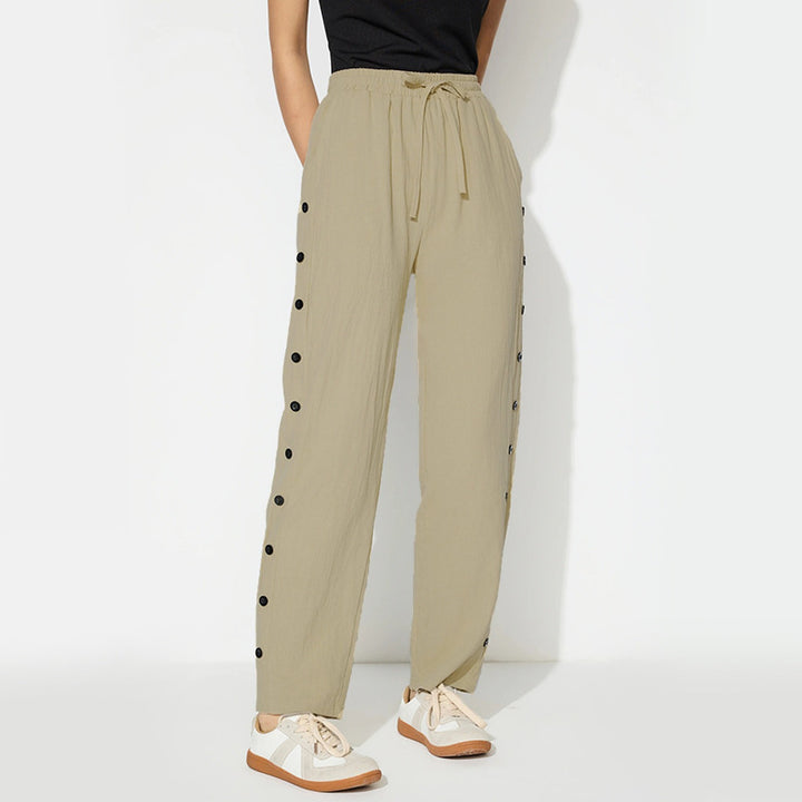 Women's fashionable jogger pants with decorative button details Chic & Stil