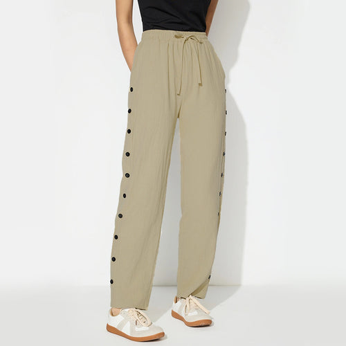 Women's fashionable jogger pants with decorative button details Chic & Stil