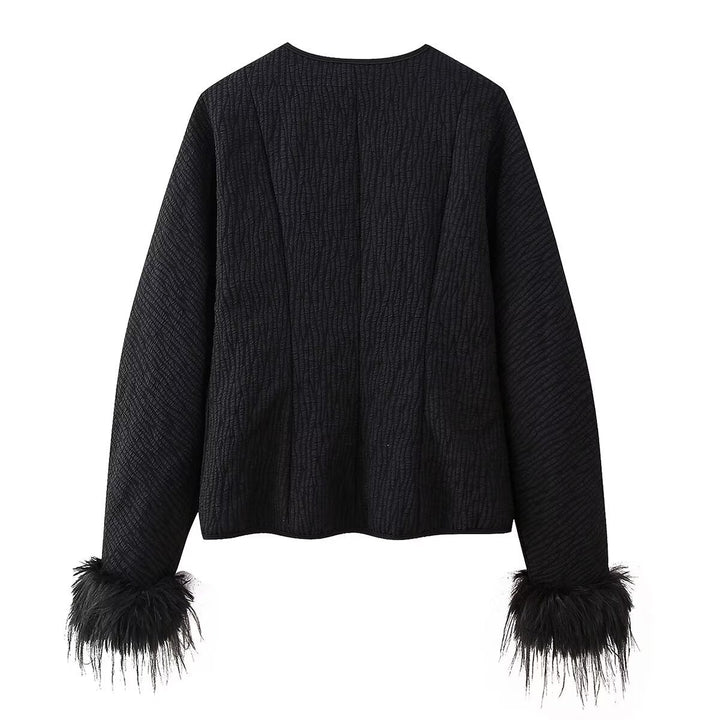 Fashion quilted jacket for women with a refined tied belt and elegant fox fur sleeves Lune London