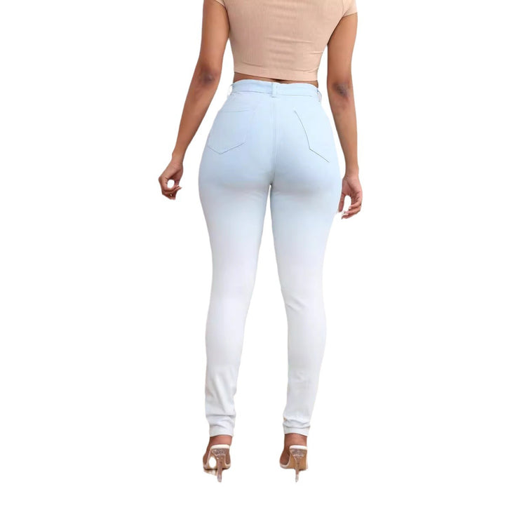 High-waisted women's fitted jeans with stylish ripped details Lune London