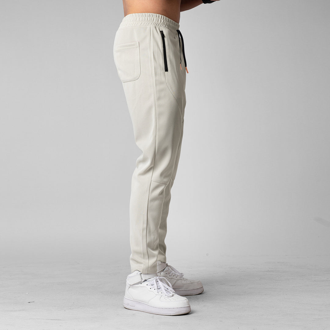 Men's sporty jogging pants with an innovative breathable structure and practical zippered pockets Lune London