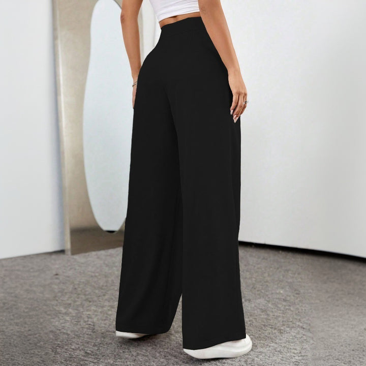 Pantalons palazzo taille haute généreux pour femme avec plis élégants et bouton visible Chic & Stil