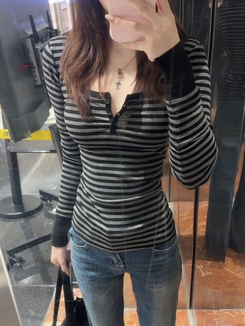 Women's long sleeve shirt with modern striped pattern and decorative button details Chic & Stil