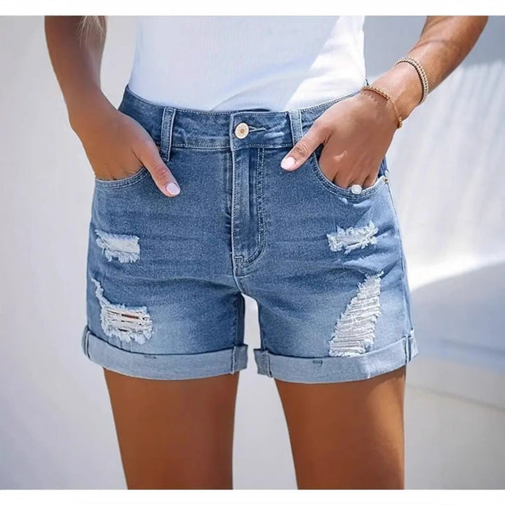 Women's short destroyed denim shorts in a casual look with rolled hems and stylish ripped details Lune London