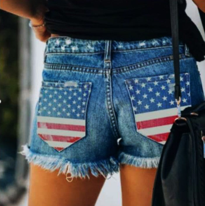 Casual style denim shorts for women with American flag print and frayed edges Lune London