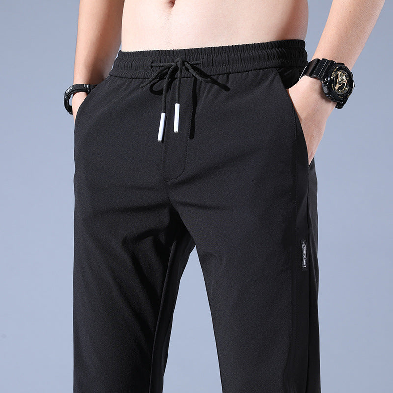 Sports jogger pants for men with elastic waist and practical zip pockets Lune London
