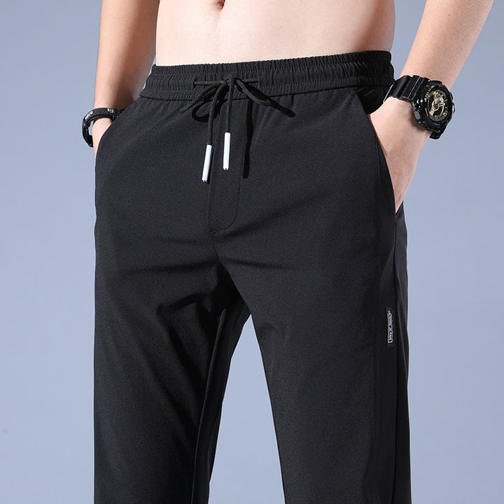 Sports jogger pants for men with elastic waist and practical zip pockets Lune London