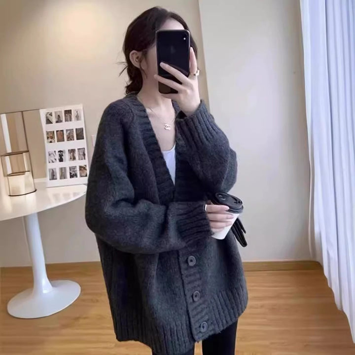 Oversized knitted jacket for women with a deep V-neck and button details Lune London