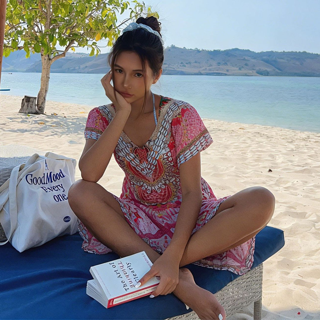 Women's beach dress with floral patterns and short cut