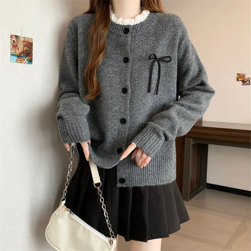 Knit cardigan for women with decorative buttons and a bow accent Lune London