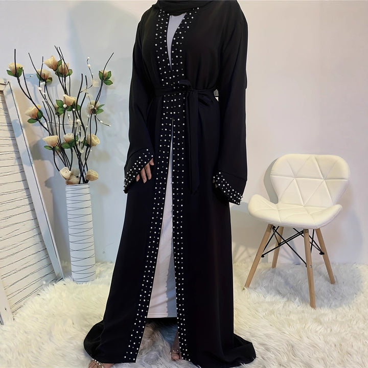 Elegant ladies Abaya with elaborate rhinestone details and a chic waist belt