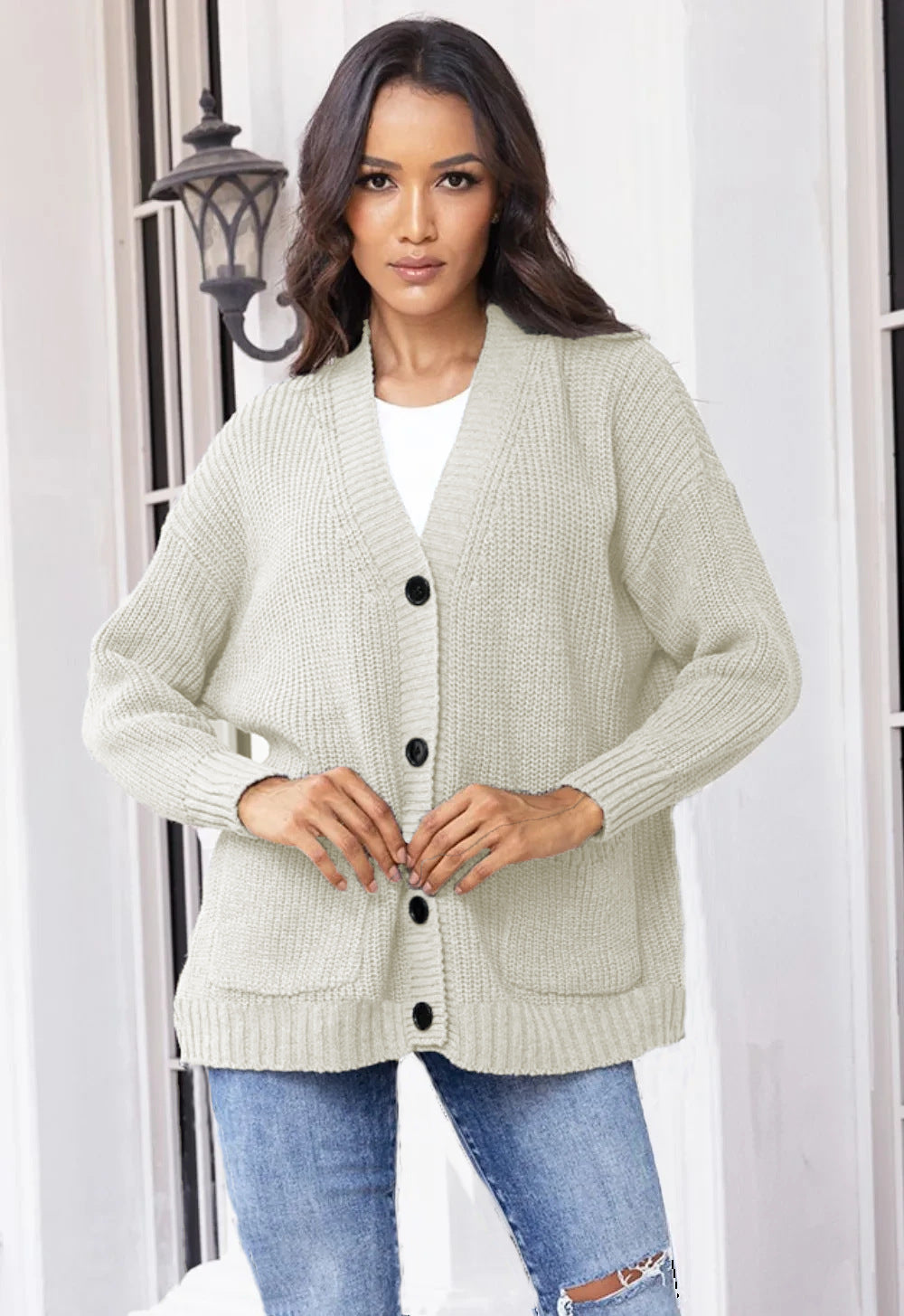 Fashionable knitted jacket for women with button closure all the way down and large pockets Lune London