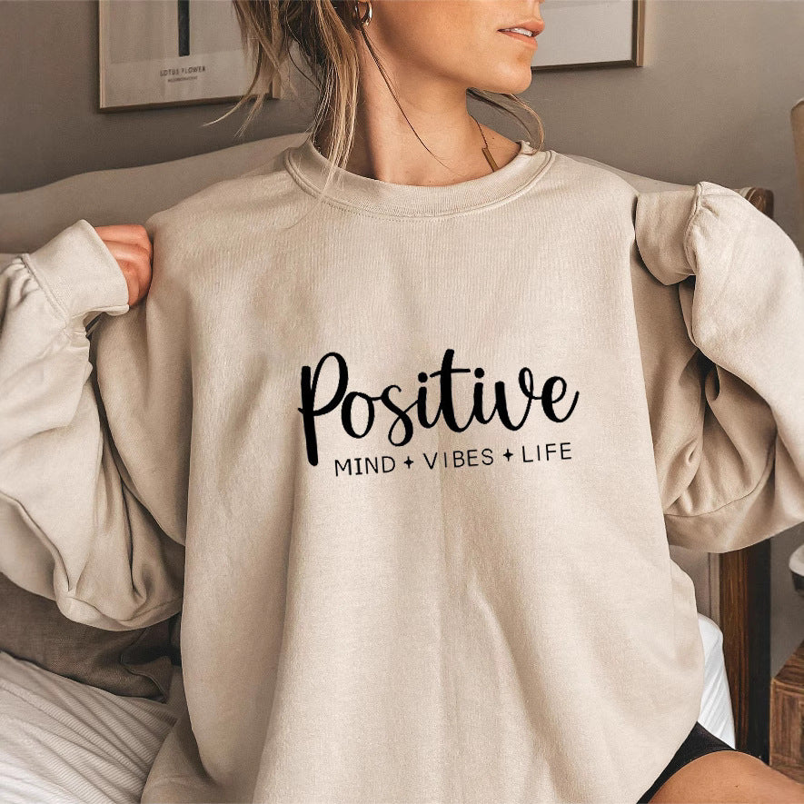Sweatshirt pour femme avec des manches voluminueuses et un imprimé inspirant Chic & Stil