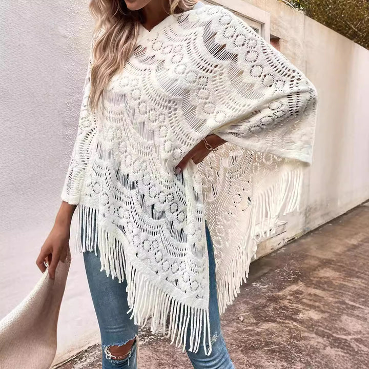 Knit poncho for women with an eye-catching crochet pattern and fashionable fringes Lune London
