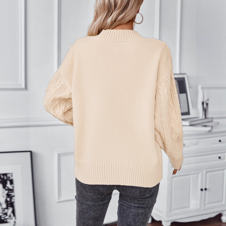 Fashionable women's knitted sweater with a unique cable design and a chic round neck. Lune London