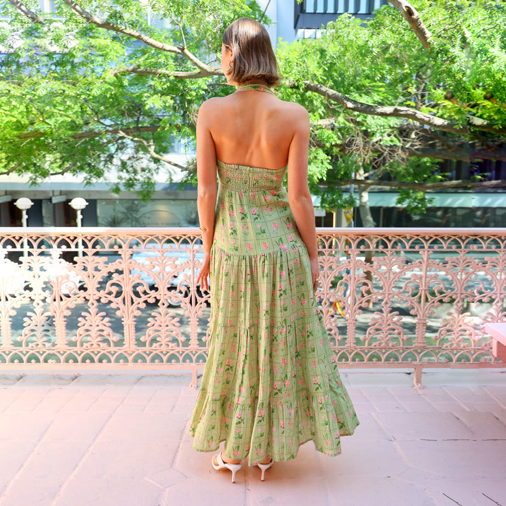 Women’s maxi dress with playful halterneck design and floral pattern mix Lune London