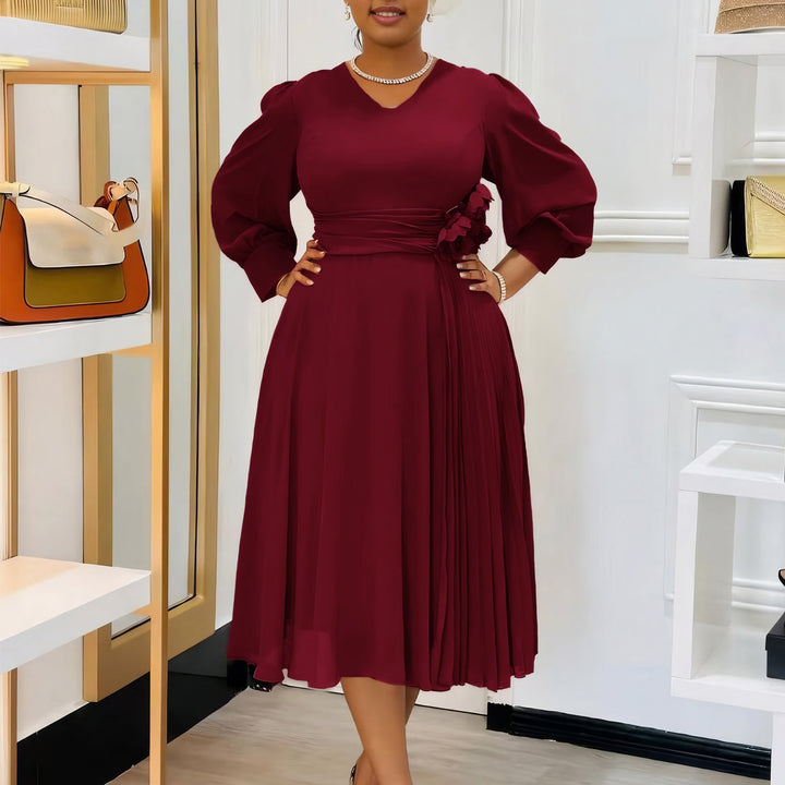 Elegant dress for women with decorative floral accent and draping Lune London