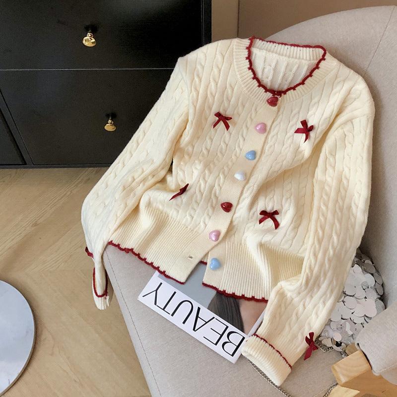 Knitted jacket for women with a playful cable pattern and colorful button details Lune London