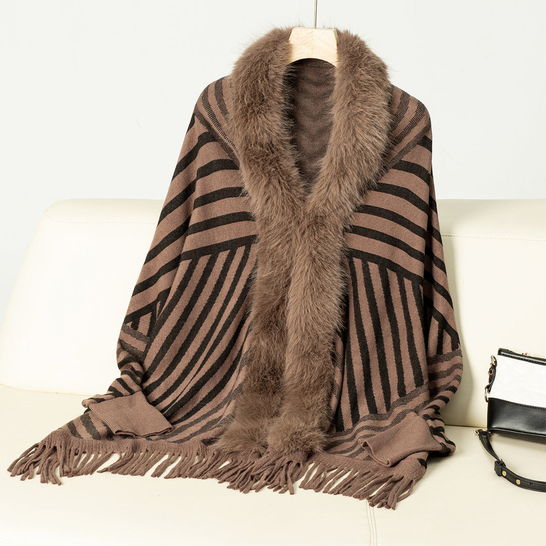 Ladies knitted poncho with elegant faux fur collar and fringe design Lune London