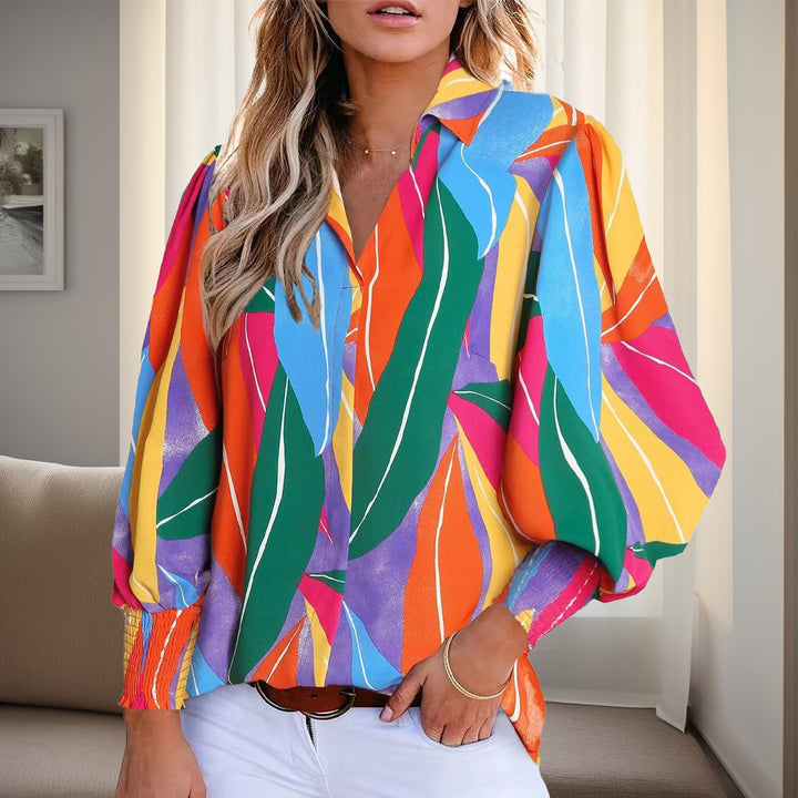 Shirt blouse for women with a vibrant floral design featuring off-shoulder and elastic cuffs Lune London