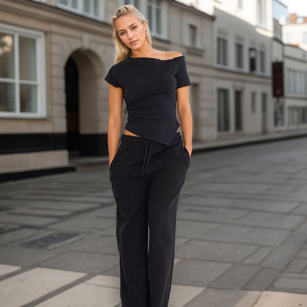 Asymmetrical top for women with trendy halter design and decorative cutout Chic & Stil