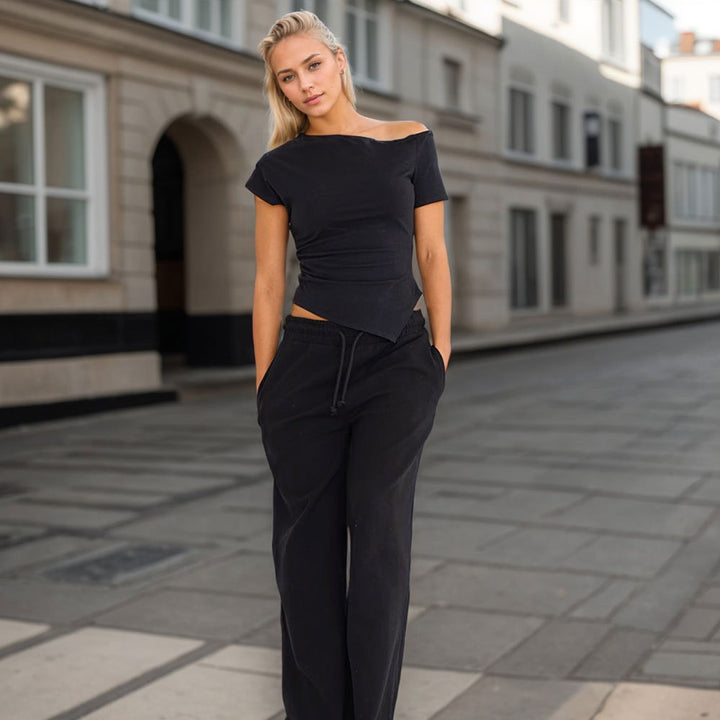Asymmetrical top for women with trendy halter design and decorative cutout Chic & Stil