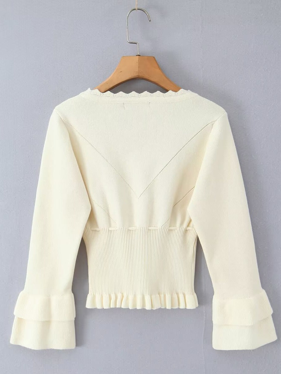 Short sleeve knitted jacket for women with ruffle details and button closure Lune London