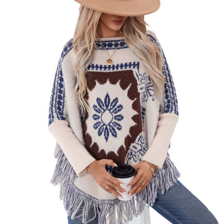 Ladies elegant knitted poncho with artistic pattern and fringe finish Lune London