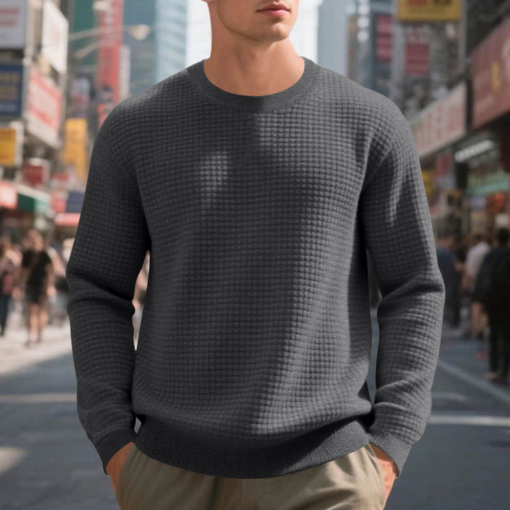Elegant structured knit sweater for men with a round neck and comfortable feel. Chic and style