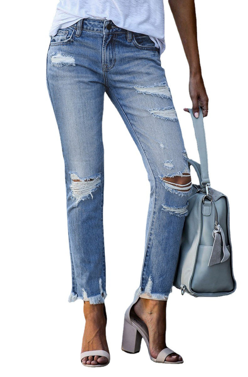 Destroyed jeans for women in a casual boyfriend style with frayed hems Lune London