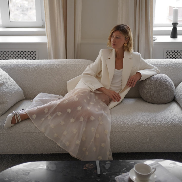 Elegant and lightweight maxi skirt for ladies with a floral glimpse and fine feather accents Lune London