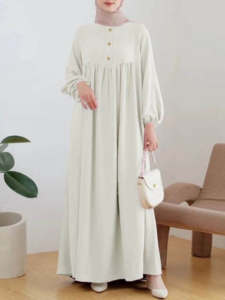 Lightweight maxi dress for women with comfortable buttoning and elegant puff sleeves Lune London