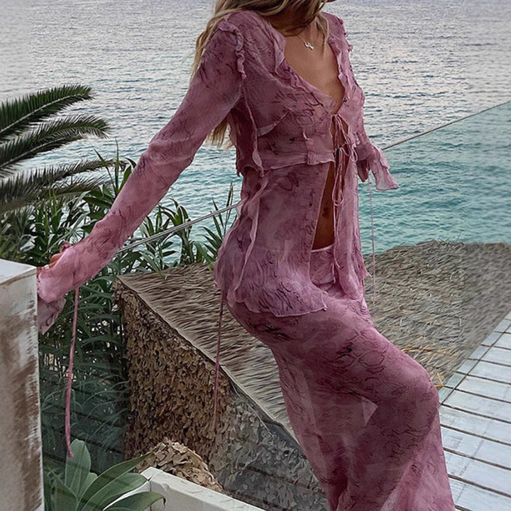 Elegant maxi dresses with cutouts for women featuring fluid fabric and refined ruffle details Lune London