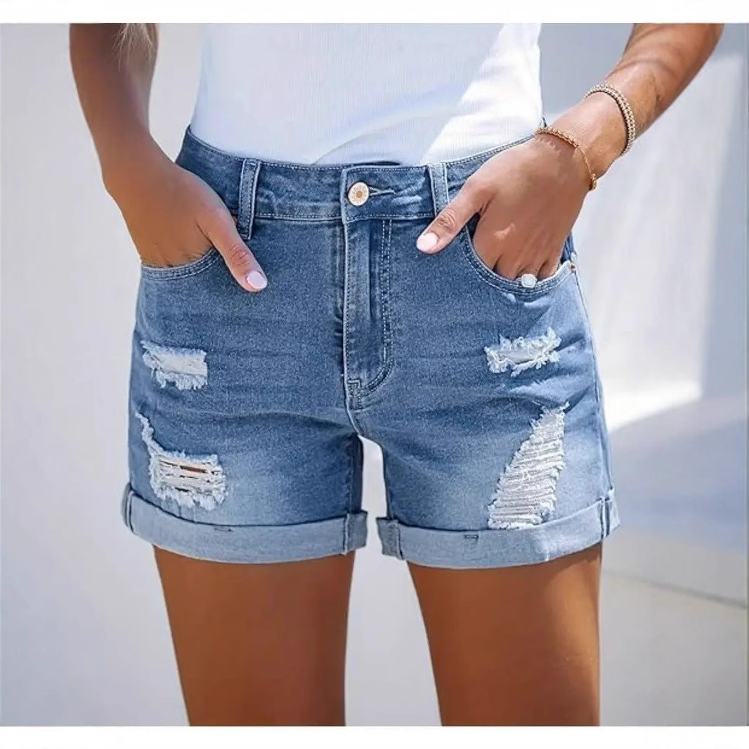 Women's short destroyed denim shorts in a casual look with rolled hems and stylish ripped details Lune London