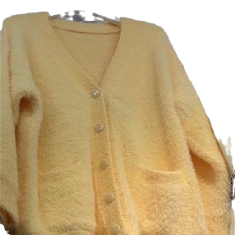 Ladies oversized knit cardigan with soft fleece and special button details Lune London