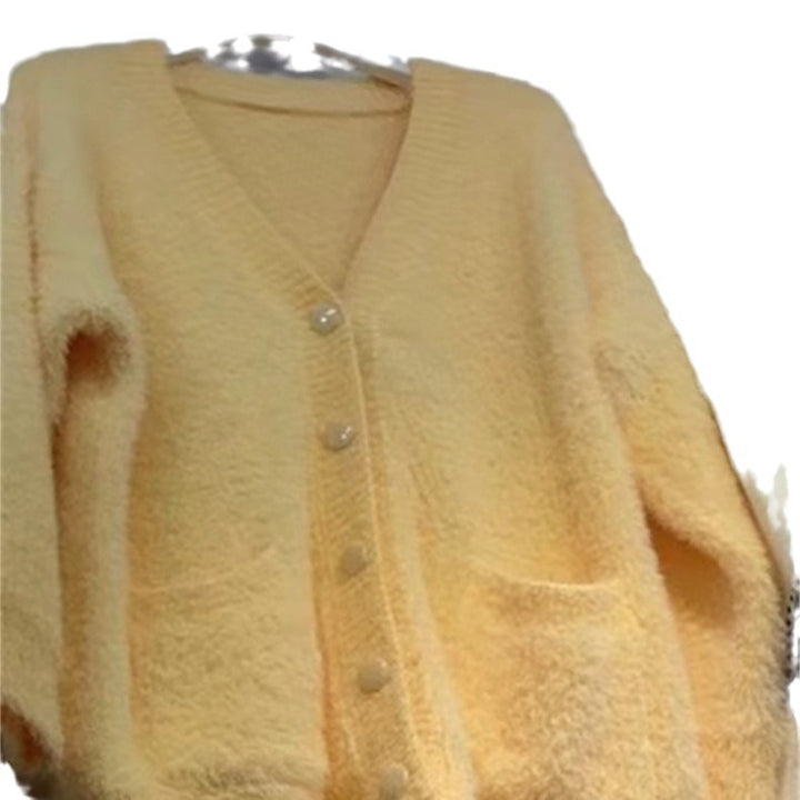 Ladies oversized knit cardigan with soft fleece and special button details Lune London
