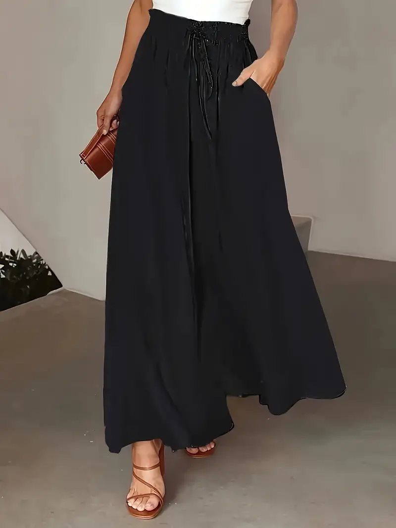 Ladies' culotte pants with elastic waist and embroidered polka dot pattern Lune London