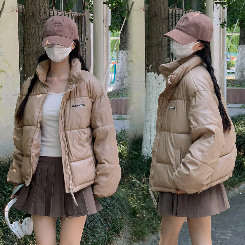 Trendy winter jacket for women with a high collar and zippered side pockets.