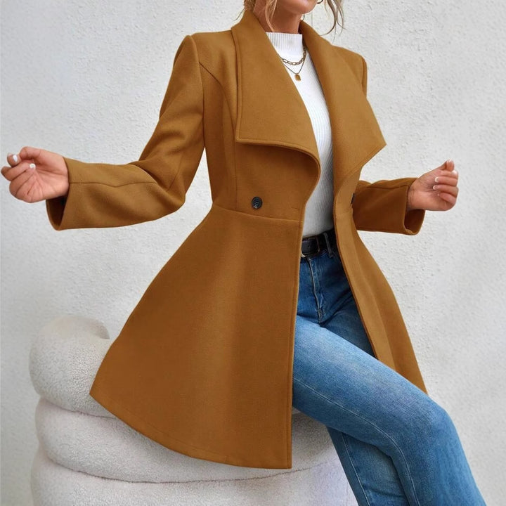 Ladies elegant wool coat with a loose and cinched silhouette and modern button details Lune London