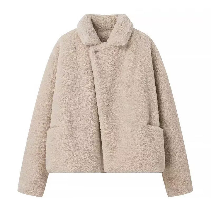 Fluffy teddy coat for women with elegant lapels and practical piped pockets Lune London