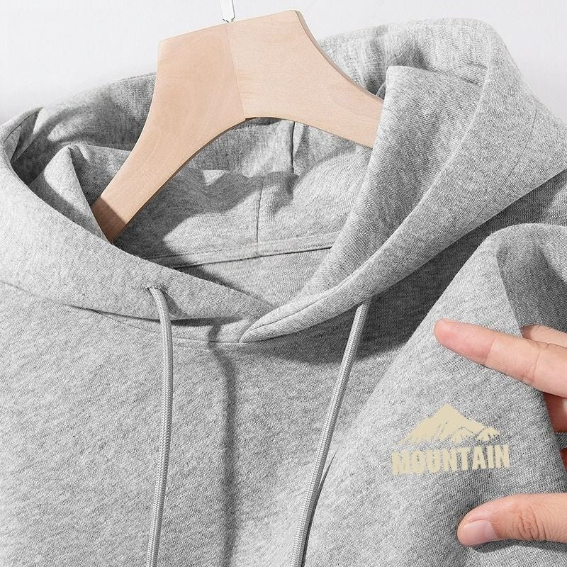 Women's hoodie with modern mountain motif and practical pockets Chic & Stil