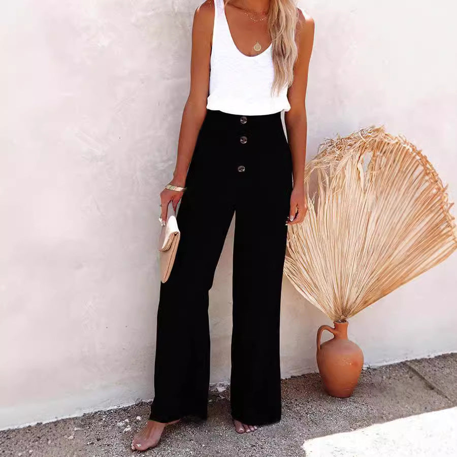 Loose summer trousers for women with elastic waist and button details Lune London