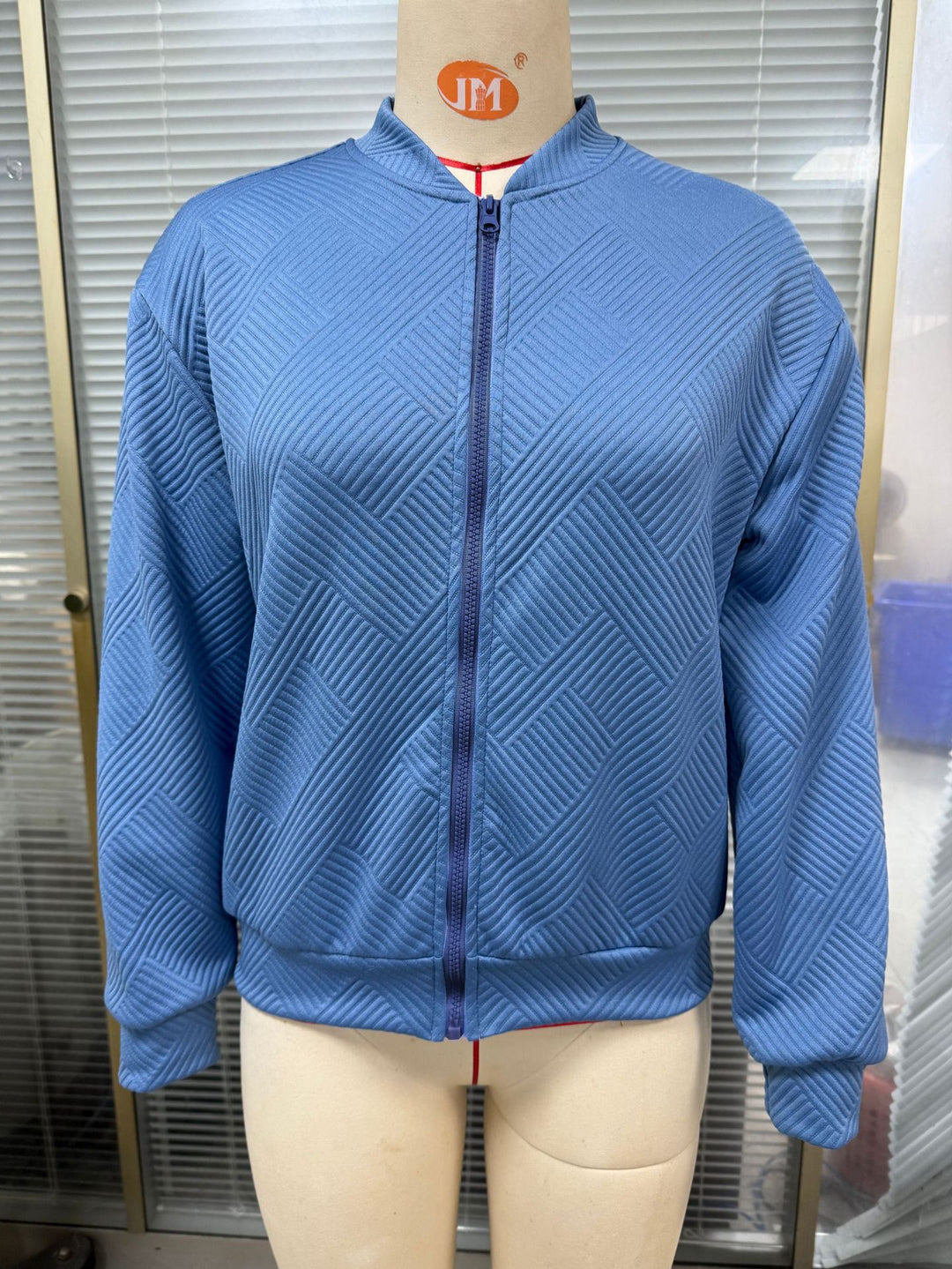 Ladies casual knit jacket with textured pattern and practical pockets Lune London